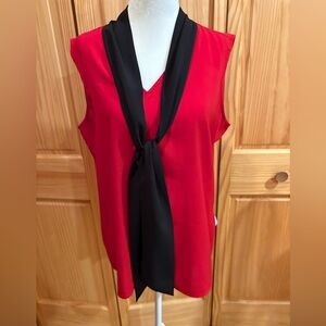 Calvin Klein's sleeveless red top features a black tie neckline